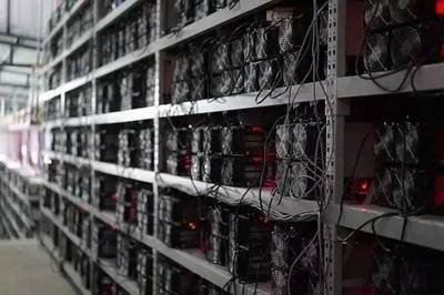 Vast Bitcoin mining farm illuminated at night