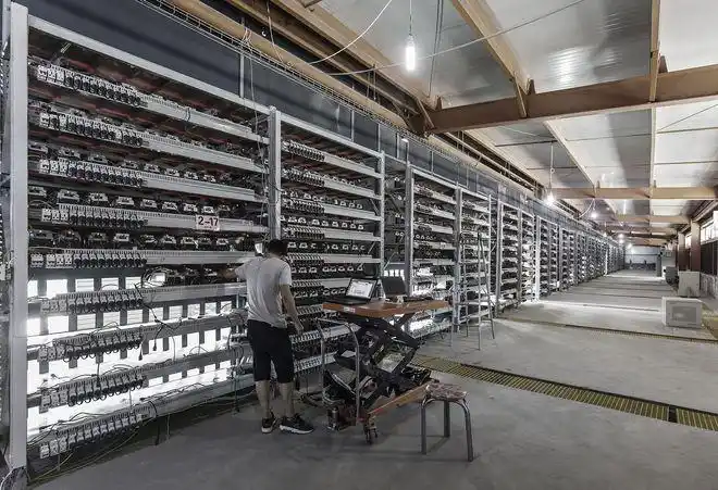 A modern mining farm in Germany housing various cryptocurrency miners, including Bitcoin and Ethereum rigs